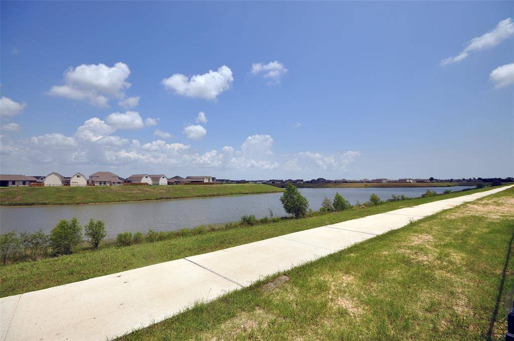 A concrete walking trail runs around the lake for approximately 1.25 miles.