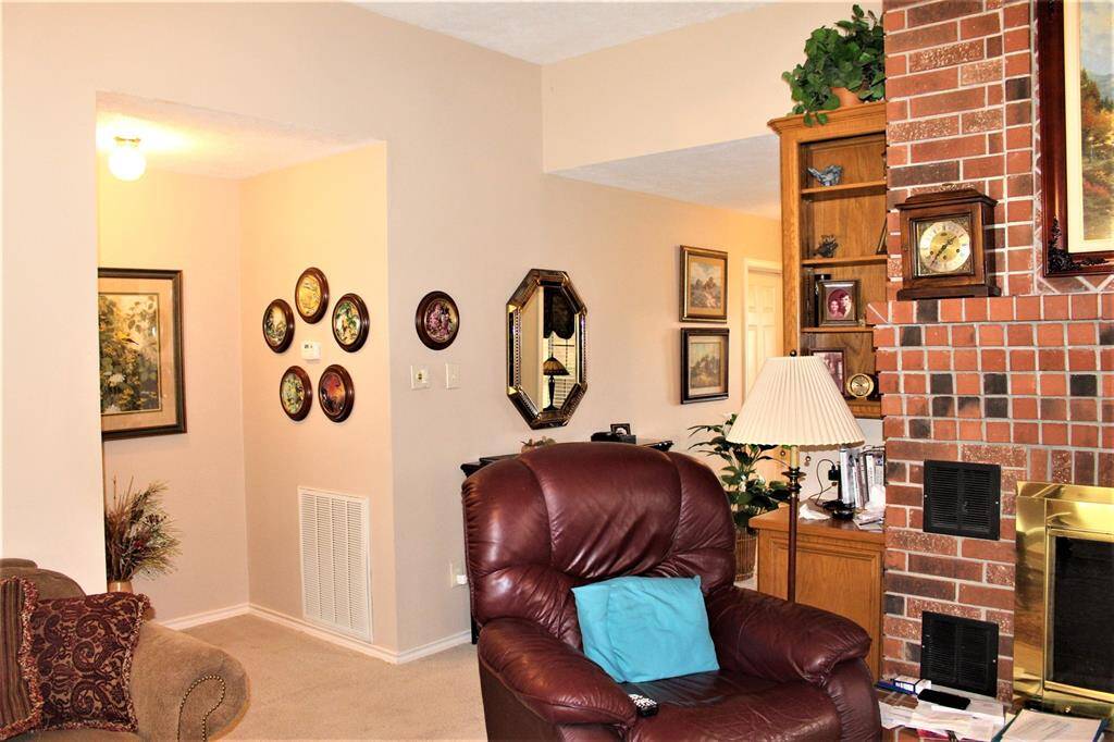 Living room showing entrance to Primary Bedroom.