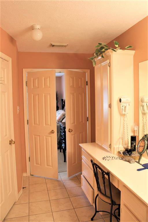 Double doors lead back into Primary Bedroom.