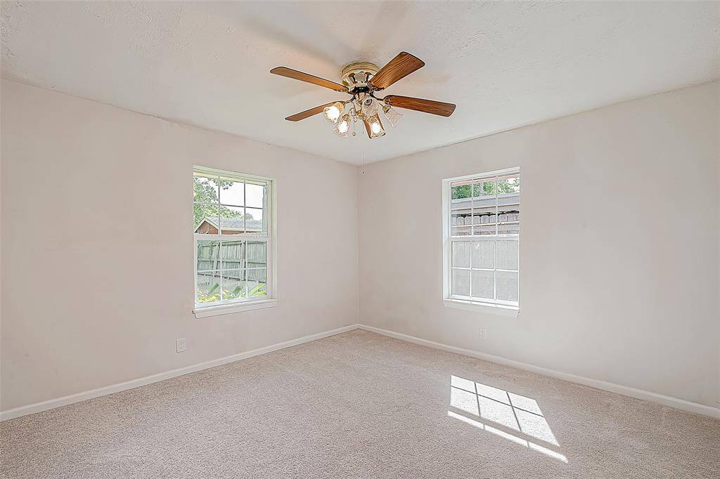 THE PRIMARY BEDROOM IS LOCATED AT THE BACK OF THE HOME & FEATURES DUAL CLOSETS, ENSUITE BATH, AND VIEWS OF THE BACKYARD.