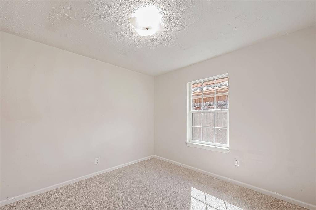 BEDROOM 3 OFFERS PLUSH CARPETING.