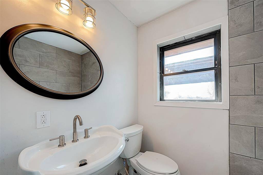 LIGHTING, MIRROR, SINK, FAUCET AND MORE HAVE BEEN UPGRADED IN THE SECONDARY BATHROOM.