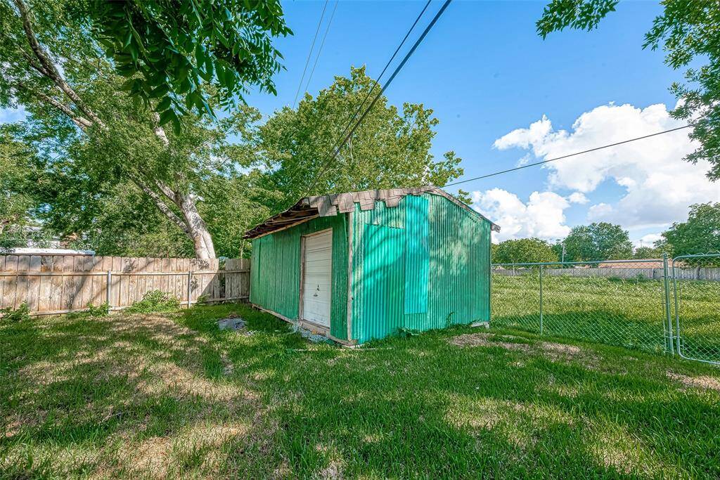 SPACIOUS SHED IS IDEAL FOR LAWN CARE AND SEASONAL ITEMS.