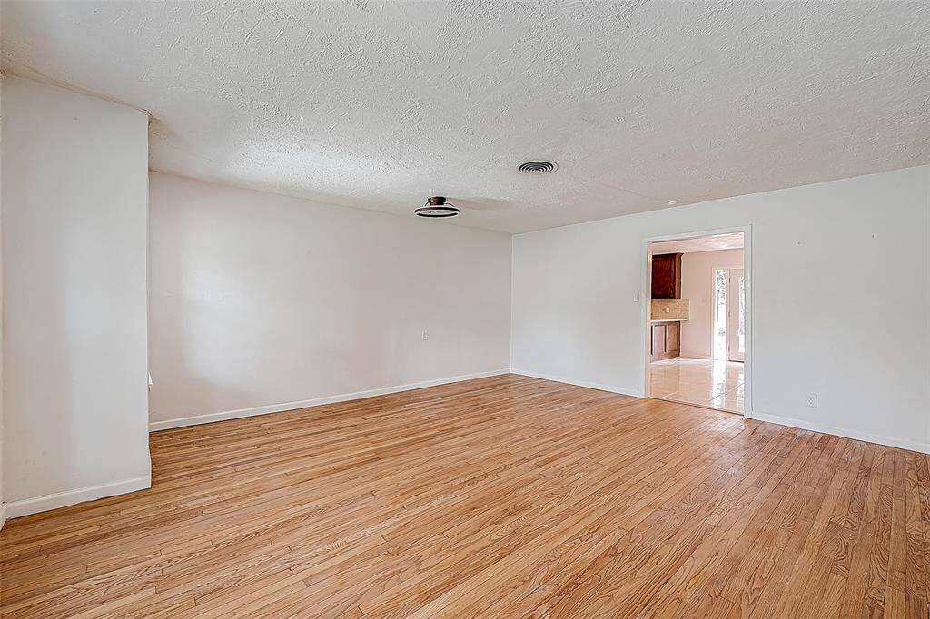 STEP INSIDE AND TAKE NOTE OF THE ORIGINAL, REFINISHED HARDWOOD FLOORS AND FRESH INTERIOR PAINT.