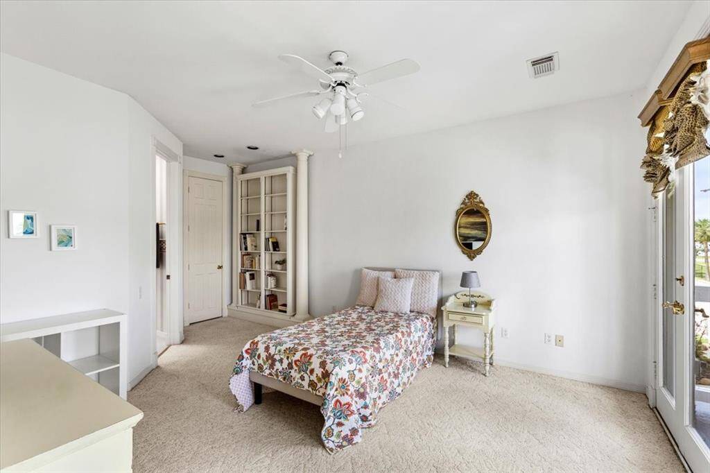 Upstairs secondary bedroom with attached bath