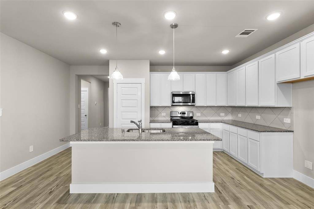 Granite Countertops and Ceramic Tile Backsplash