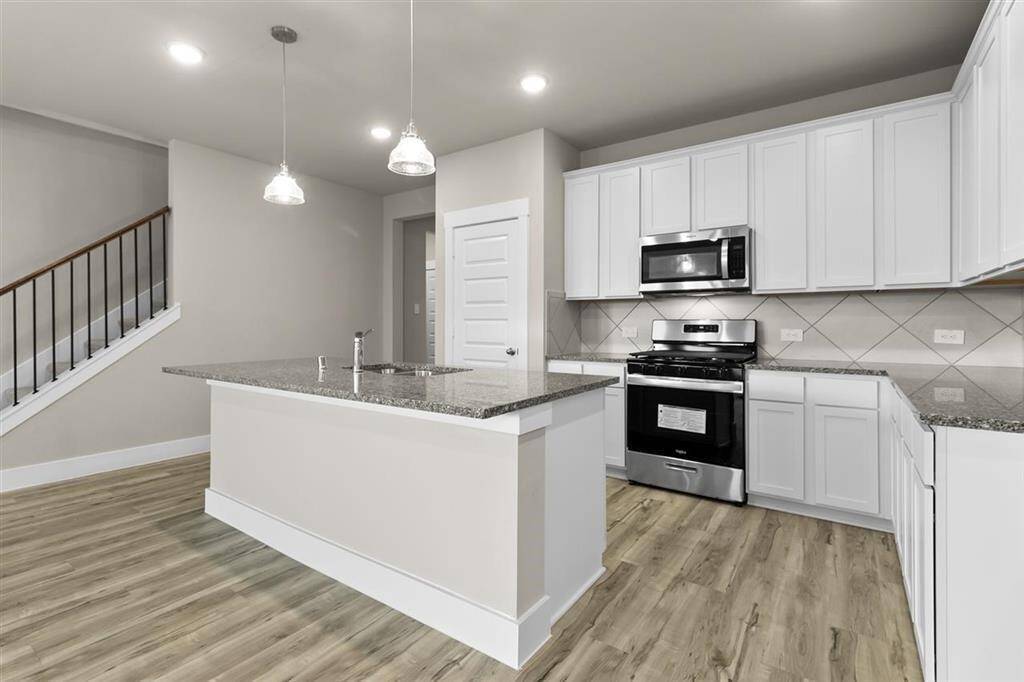 Built-In Sink, and Beautiful Pendant Lights