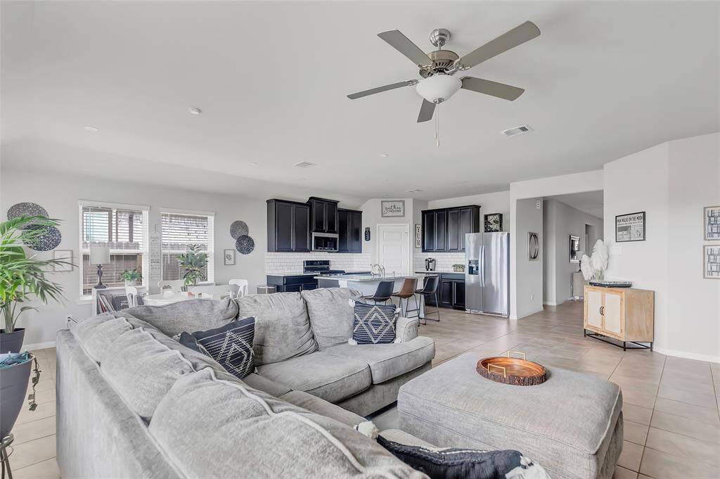 Living room, kitchen, and breakfast area.