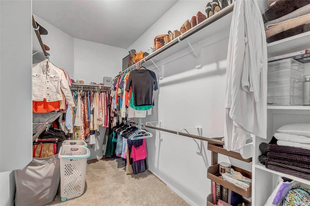 Massive primary bedroom closet.