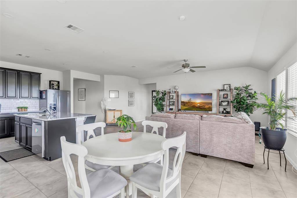 A view from the breakfast area to the living room and kitchen.