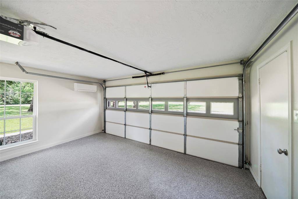 Storage area that was once a garage.  Has new door opener and is under its own AC.  Perfect man-cave or she-shed.