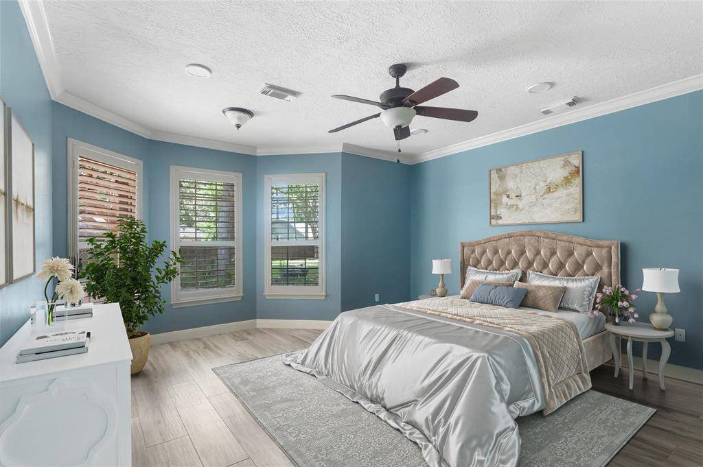 Virtual staging of the primary bedroom.  Plenty of room for a sitting area along with the bedroom furniture.