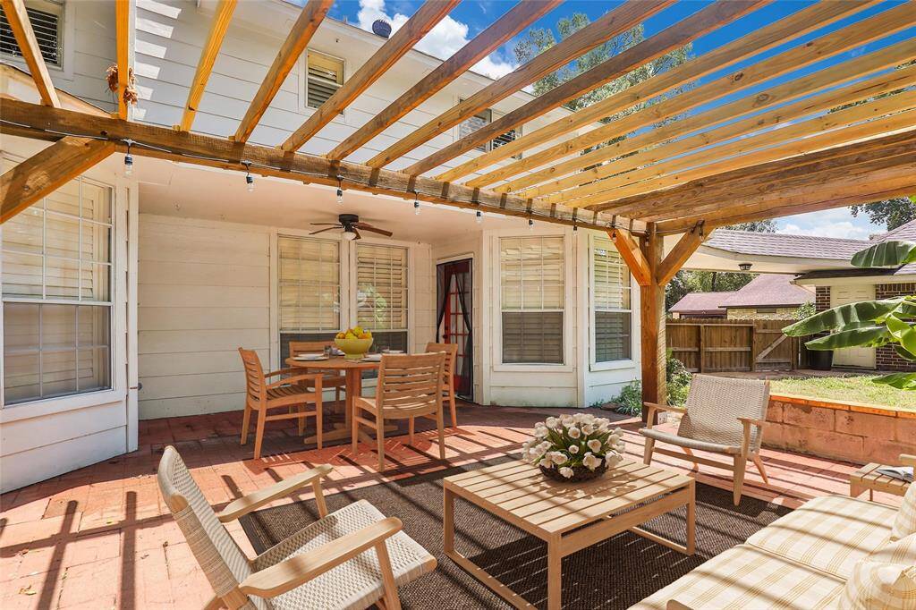 Virtual staging of the patio area.  Just imagine the entertaining possibilities in this oversized lot.