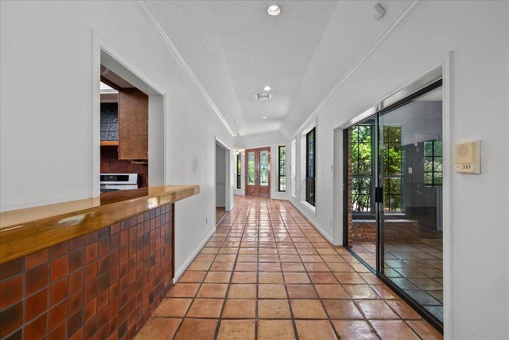 Step into elegance with this stunning foyer, a masterful addition crafted by renowned builder Rolf Schuett.