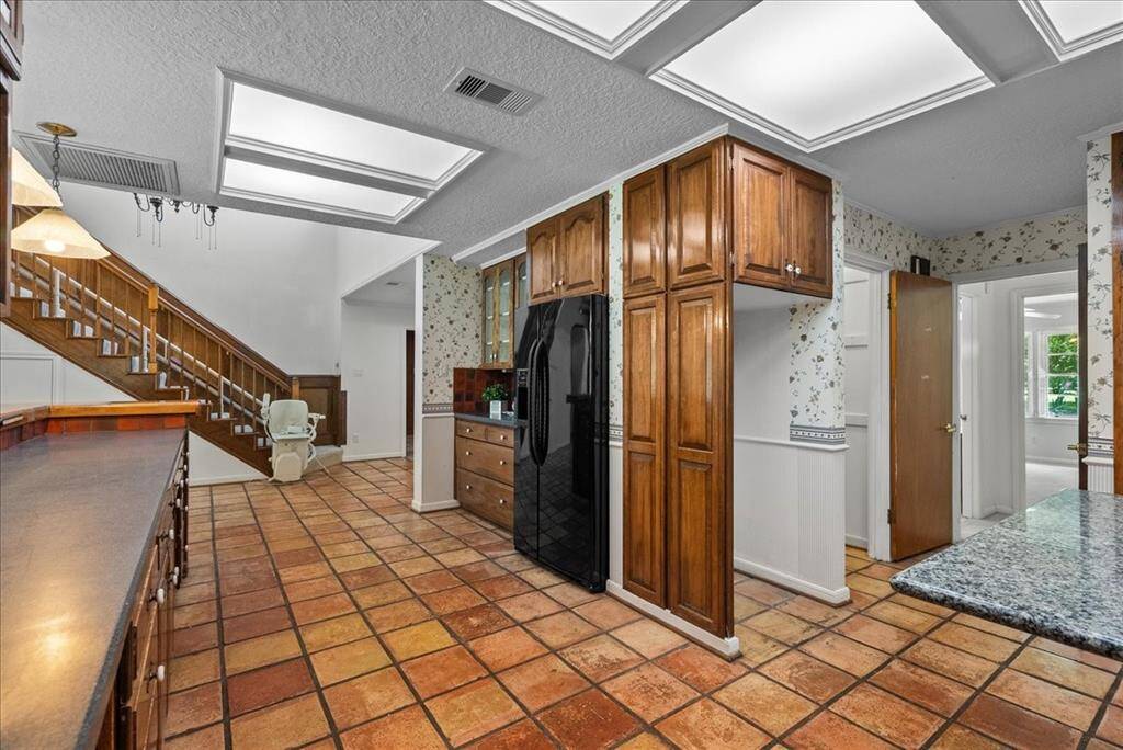 The kitchen provides ample space to accommodate a second fridge or freezer, ensuring convenience and flexibility for all your storage needs.