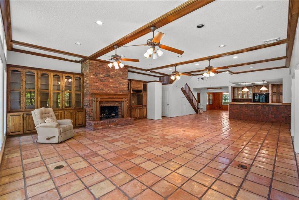 This expansive family room eagerly awaits the opportunity for you and your loved ones to create cherished memories together.