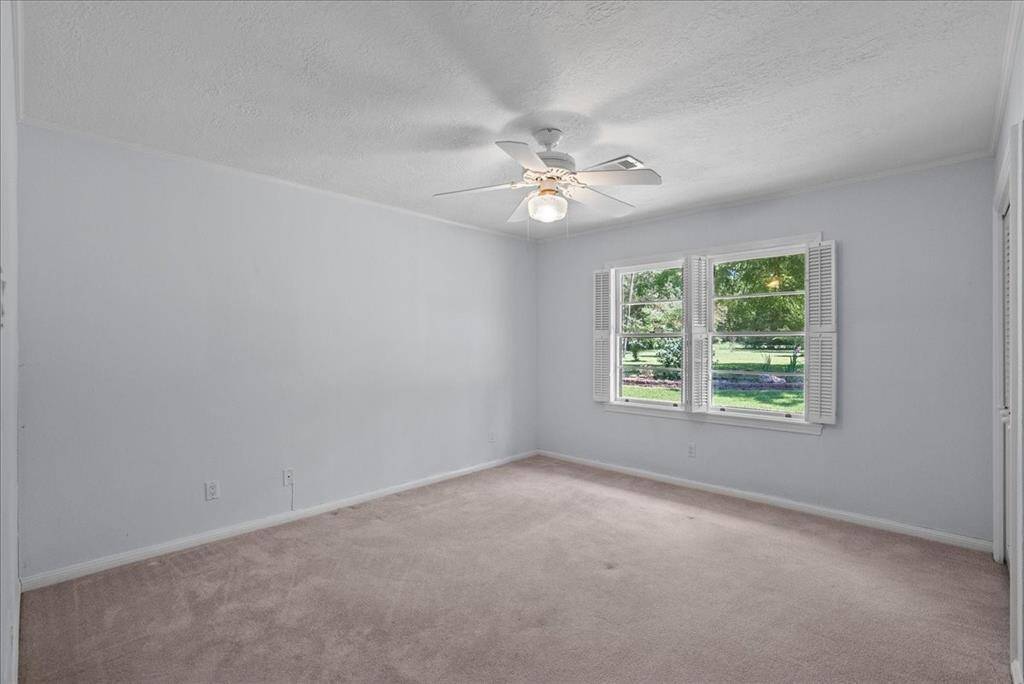 A second secondary bedroom graces the first floor, completing a total of two downstairs bedrooms, offering both convenience and versatility in living arrangements.