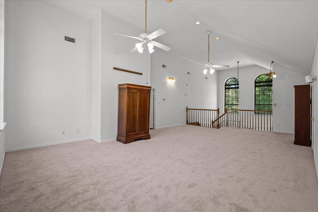 Transform this upstairs game room into your own private retreat, offering endless possibilities for relaxation and leisure.