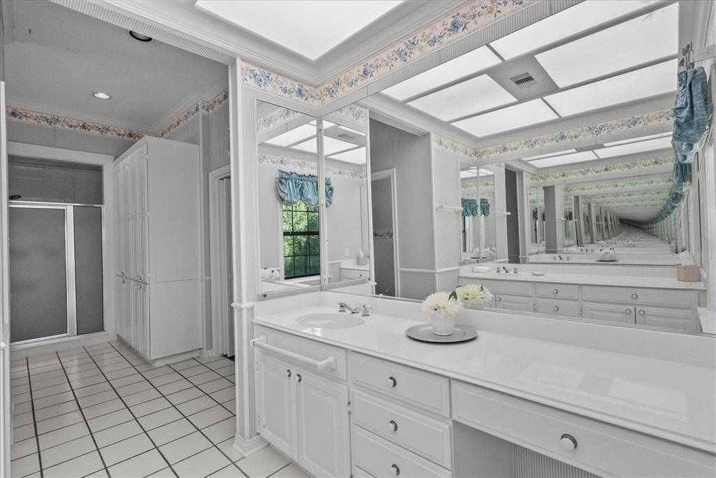 Prepare to be enchanted by the primary bathroom, featuring a walk-in shower and abundant storage options that promise both functionality and elegance.