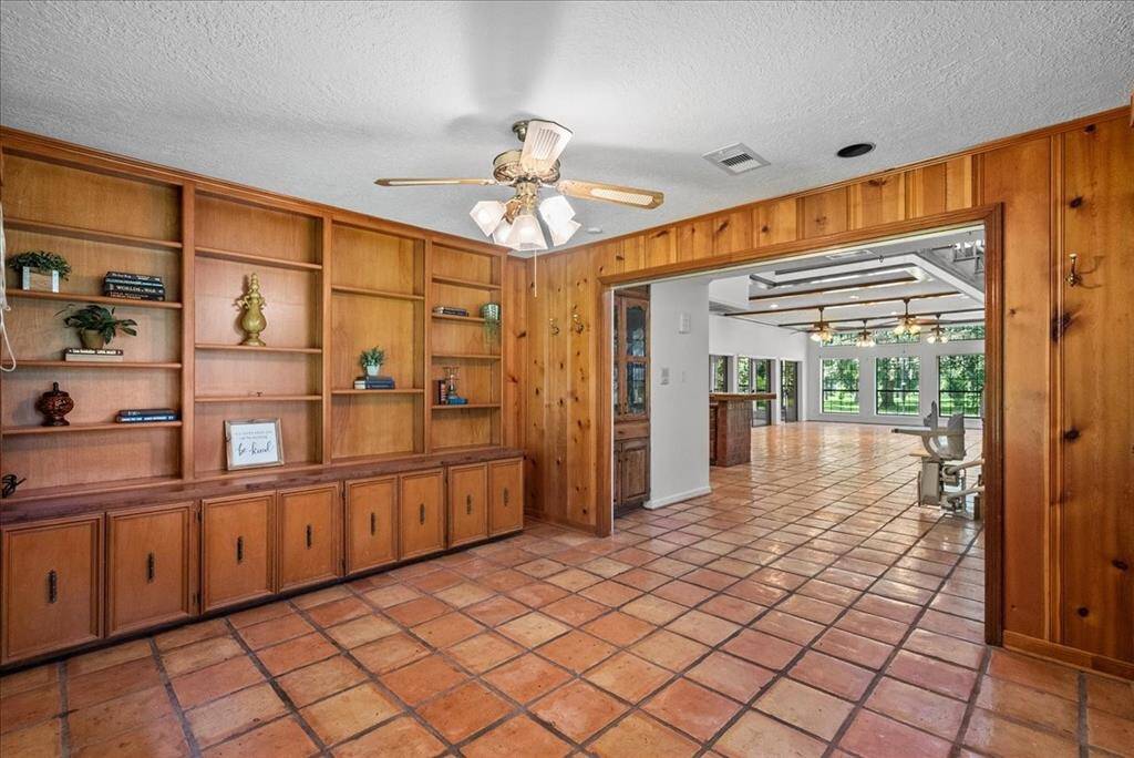 This versatile space offers the potential to serve as an additional bedroom, conveniently located near a full bath.