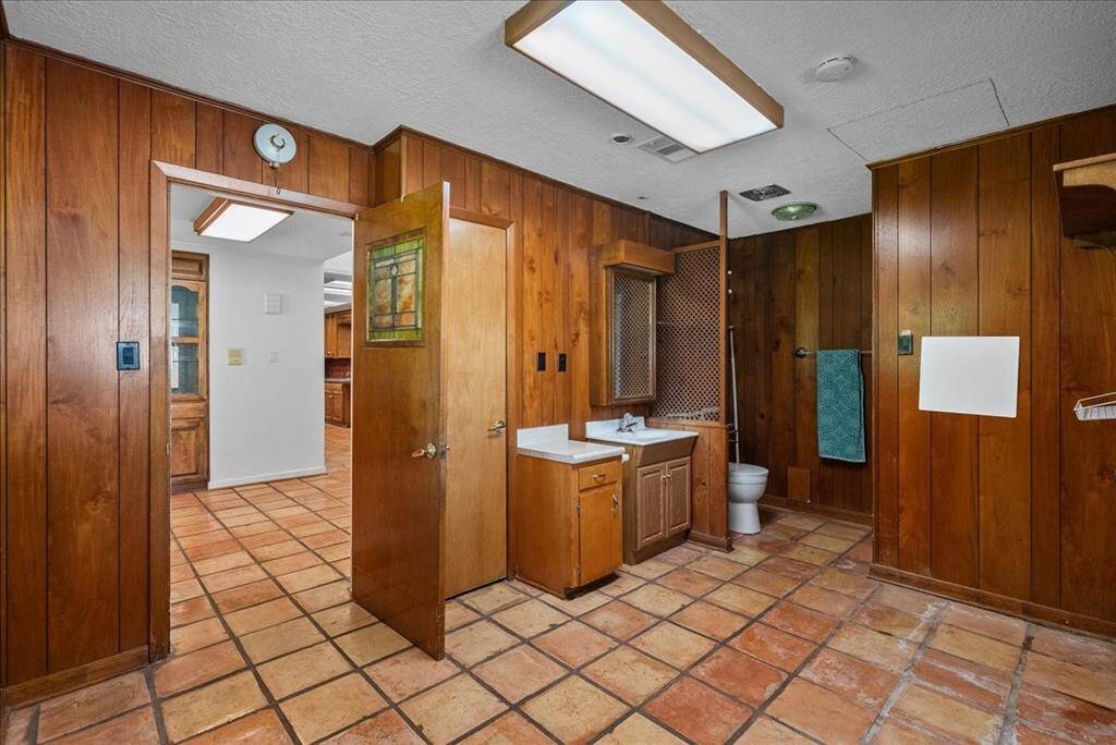 Convenience meets functionality as the laundry room finds its place on the first floor, accompanied by a complete bathroom featuring a shower for added practicality.