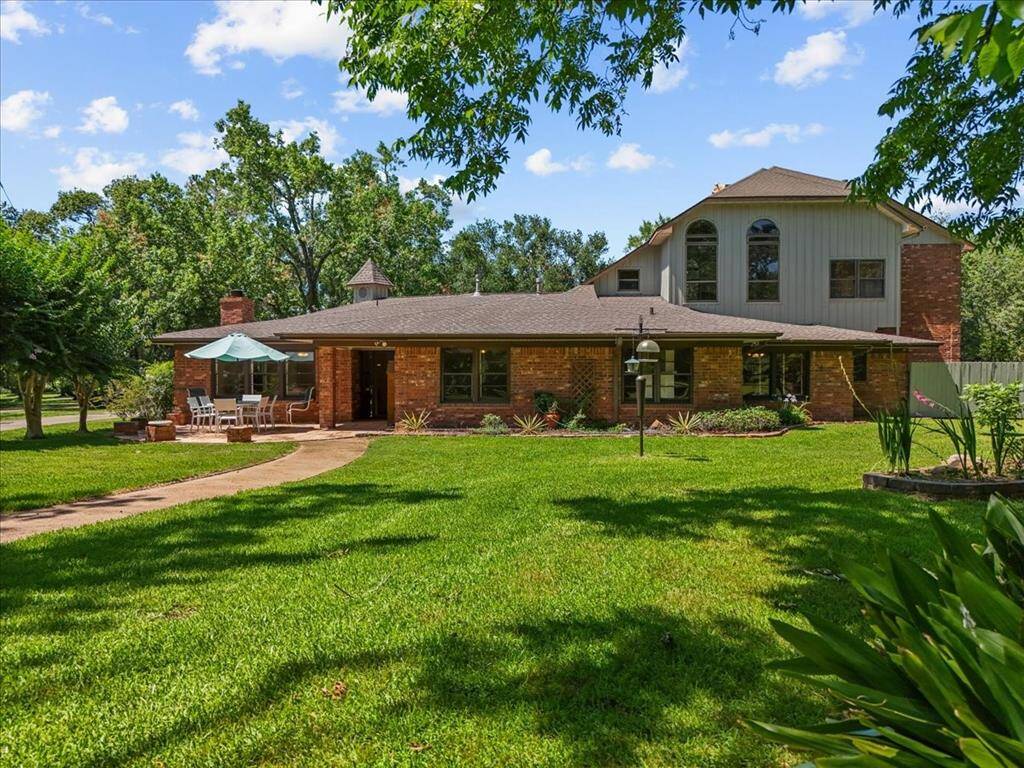 "Endless possibilities await: This oversized yard offers ample space for a garden or outdoor activities."