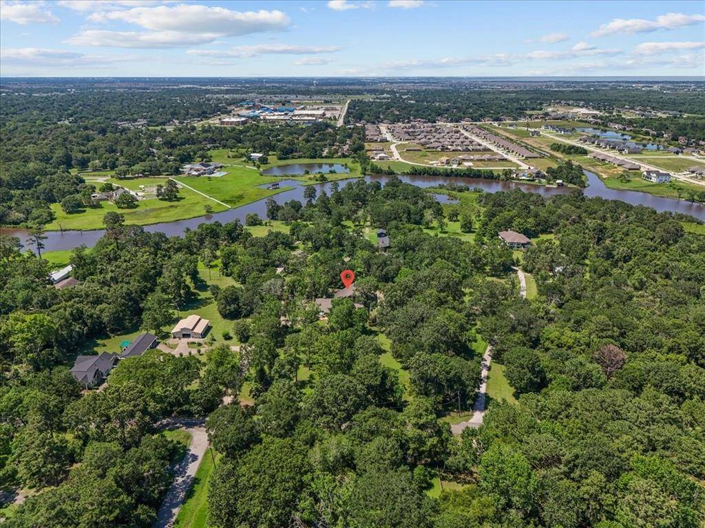 "An aerial view of this hidden gem, surrounded by mature trees and natural beauty."