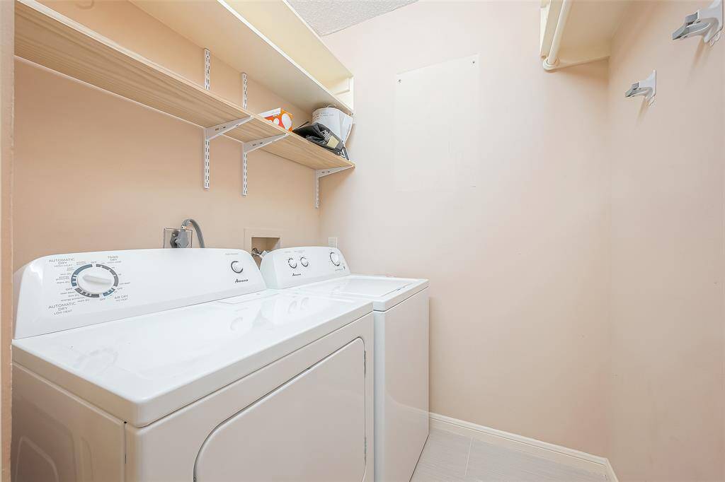 The utility room is conveniently located in the house offering easy access for completing daily chores.