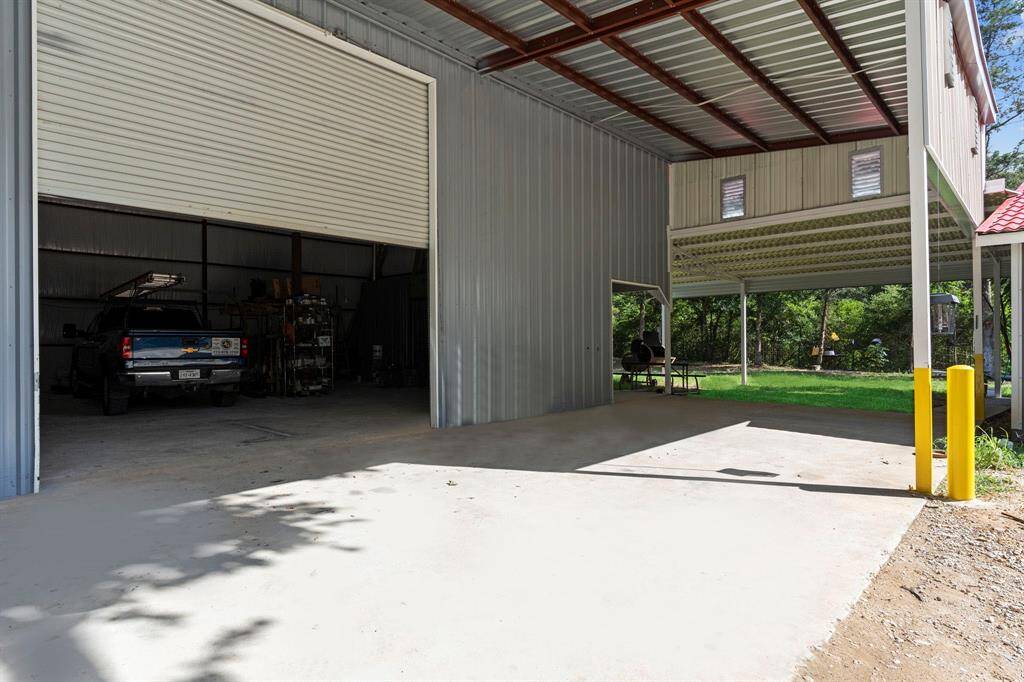 16x14 Industrial Door at the front of the Shop!  Notice the Huge Covered Patio!