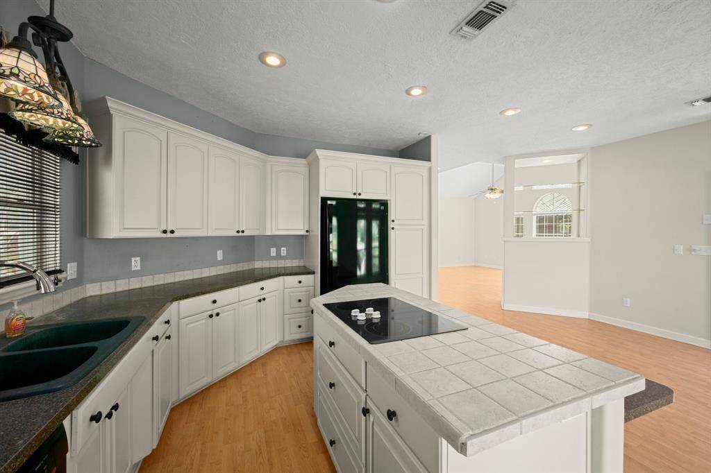 Spacious Island Kitchen includes Custom Cabinets, Breakfast Bar and Island.