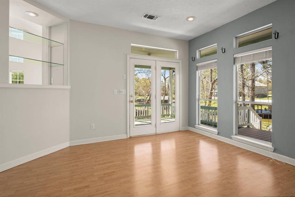 Dining Area is Open to the Kitchen for Easy Entertaining Large Families and Lots of Friends.  This Lake Home was Designed with Lots of Glass and Interesting Angles.