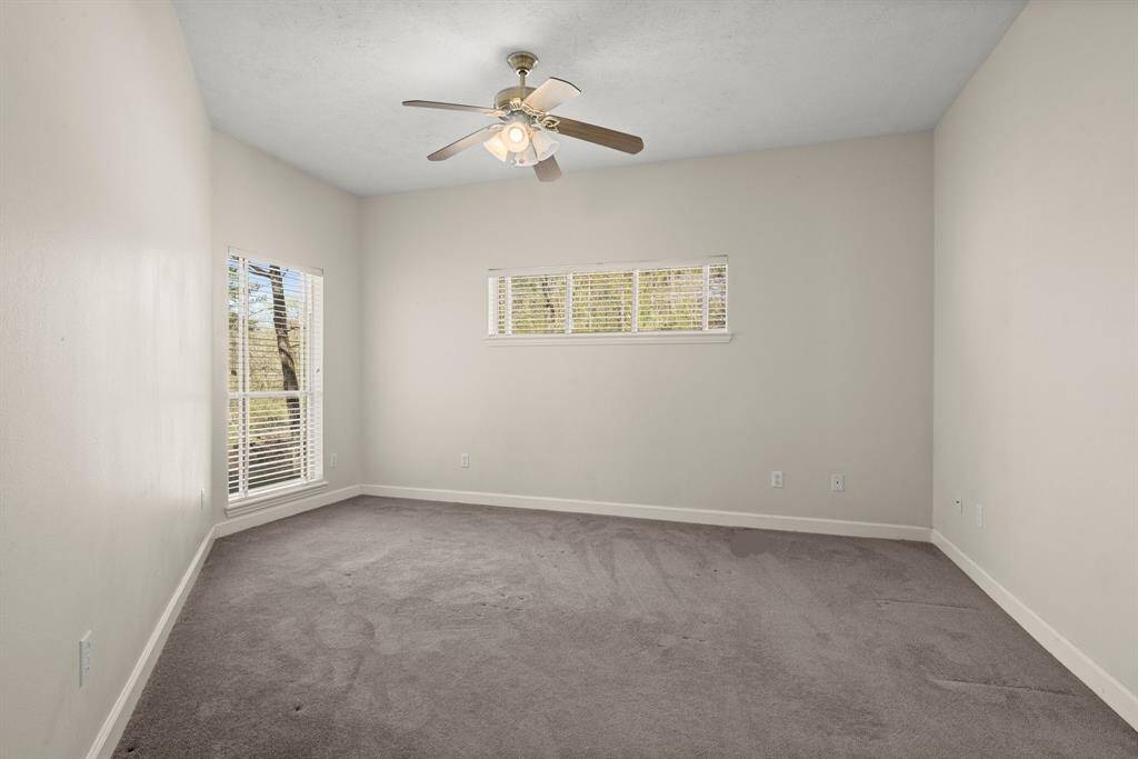 Primary Bedroom Has Interesting Angles and high ceiling.