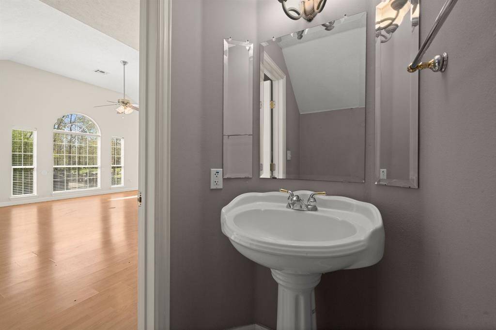 Half Bath Downstairs has a charming pedestal sink.