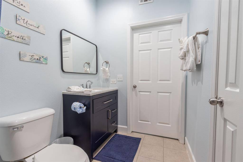Bathroom accessible from living area and bedroom.