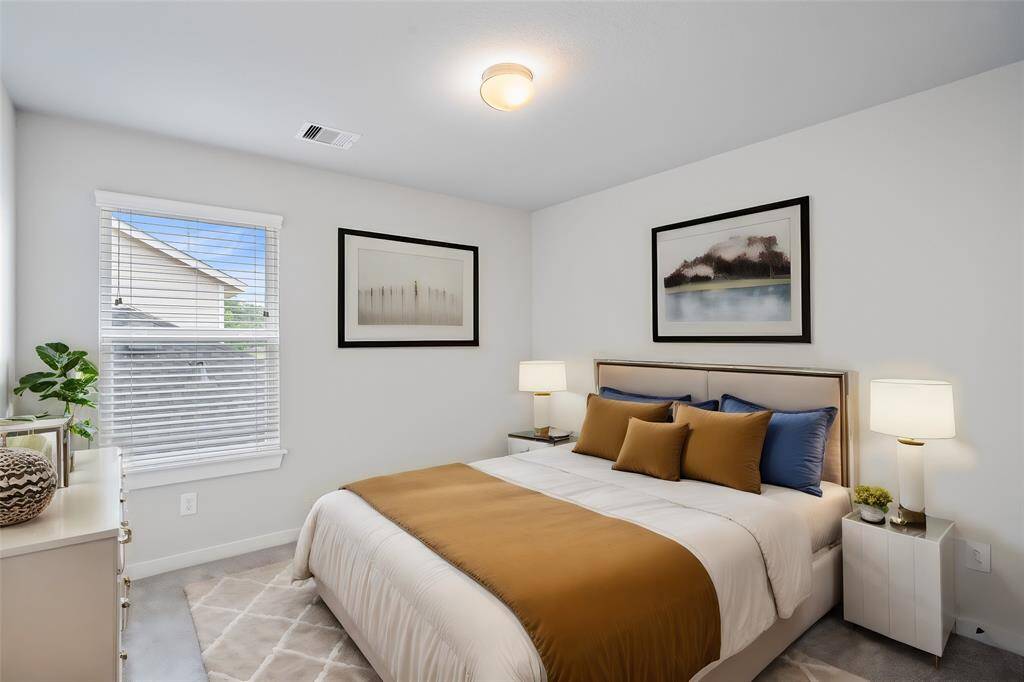 Come upstairs and enjoy a day of leisure in this fabulous game room! This is the perfect hangout spot or adult game room, this space features plush carpet, high vaulted ceiling, lighting, and neutral paint.