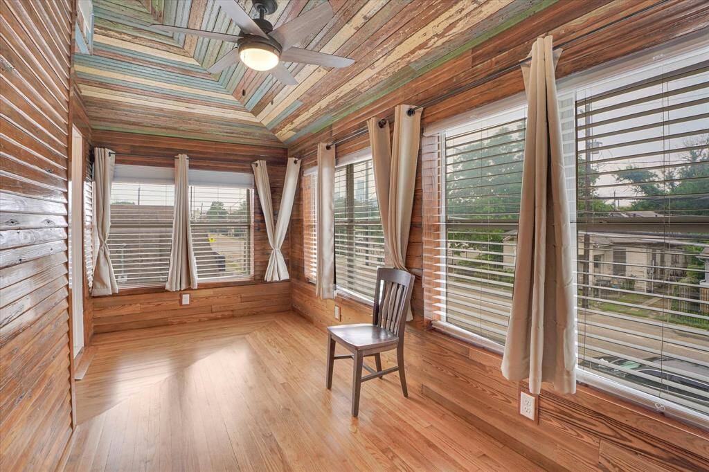 This area take you to the en suite full bath for bedroom #4. In this area you will find a pine "117"-siding along with some of the old bead board (ceiling) found on the exterior and interior of the house. Here we have oak floors. This space is about 7'X16'.