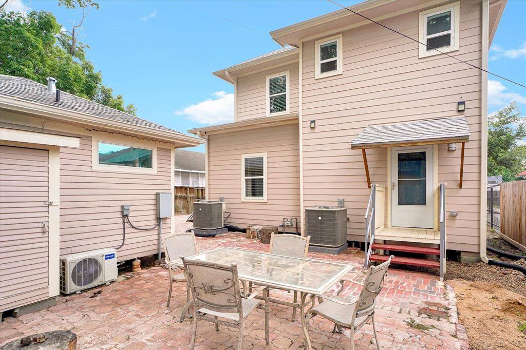Rear patio. Note rear door coming out of the 2nd utility room.  So this building has 5 entrance/exits.