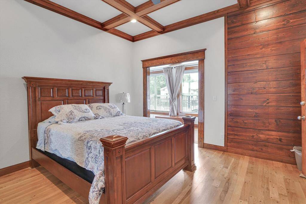 Bedroom #1.  1st floor.  Oak flooring in this room.   This space with the bed is appx 168 sqft.