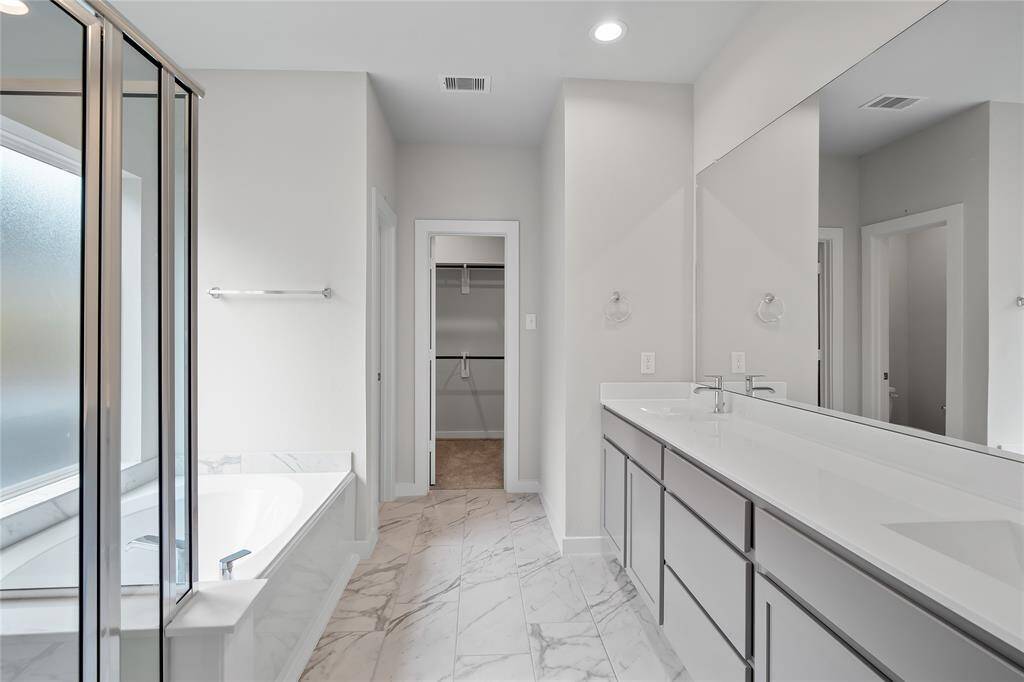 Gather the family and guests together in your lovely family room! Featuring high ceilings, ceiling fan, custom paint, gorgeous floors and large windows that provide plenty of natural lighting throughout the day.