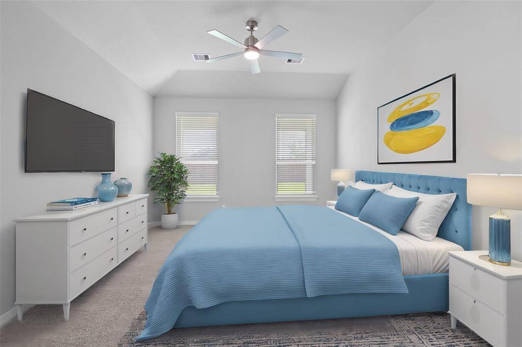 Come and unwind after a long day in this magnificent primary suite! This spacious room features plush carpet, neutral paint, high ceilings, custom ceiling fan and large windows with privacy blinds.