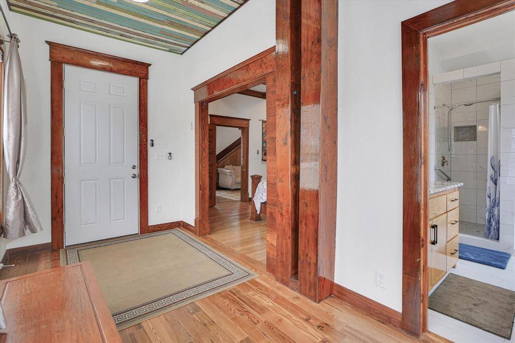 Separate ingress-egress in bedroom #1. Flooring in this area is mostly red pine.