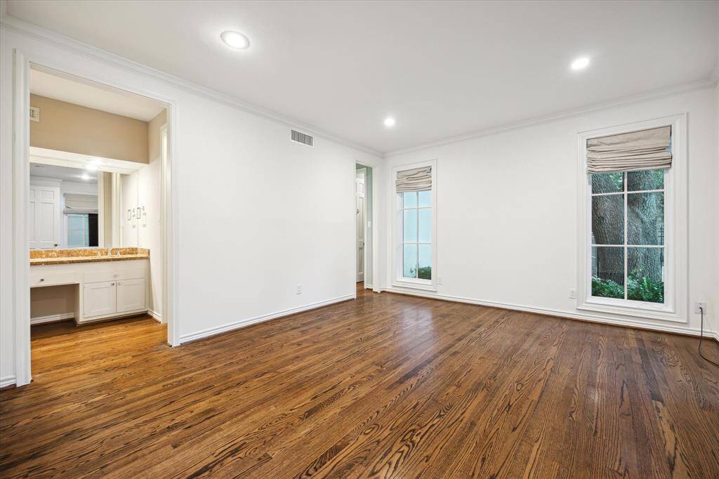 Downstairs master bedroom with separating two full bathrooms with walk in closets