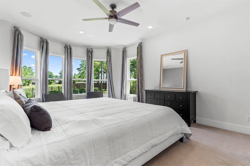 Large spacious Primary Bedroom with high ceilings and abundance of natural light