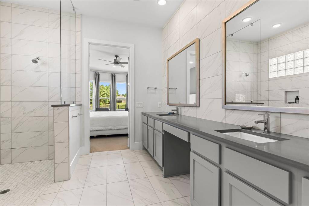 Pimary Bathroom with double sinks and shower