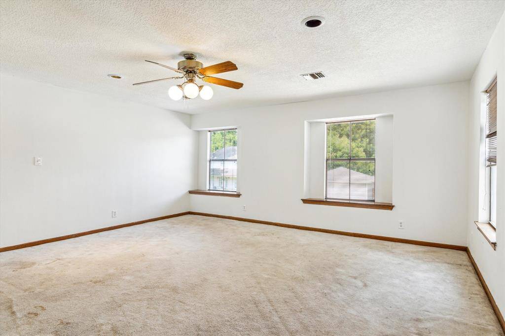 Another view of the gameroom. Note third window on the wall to the right. The windows provide a view of the front and side yards of the home.