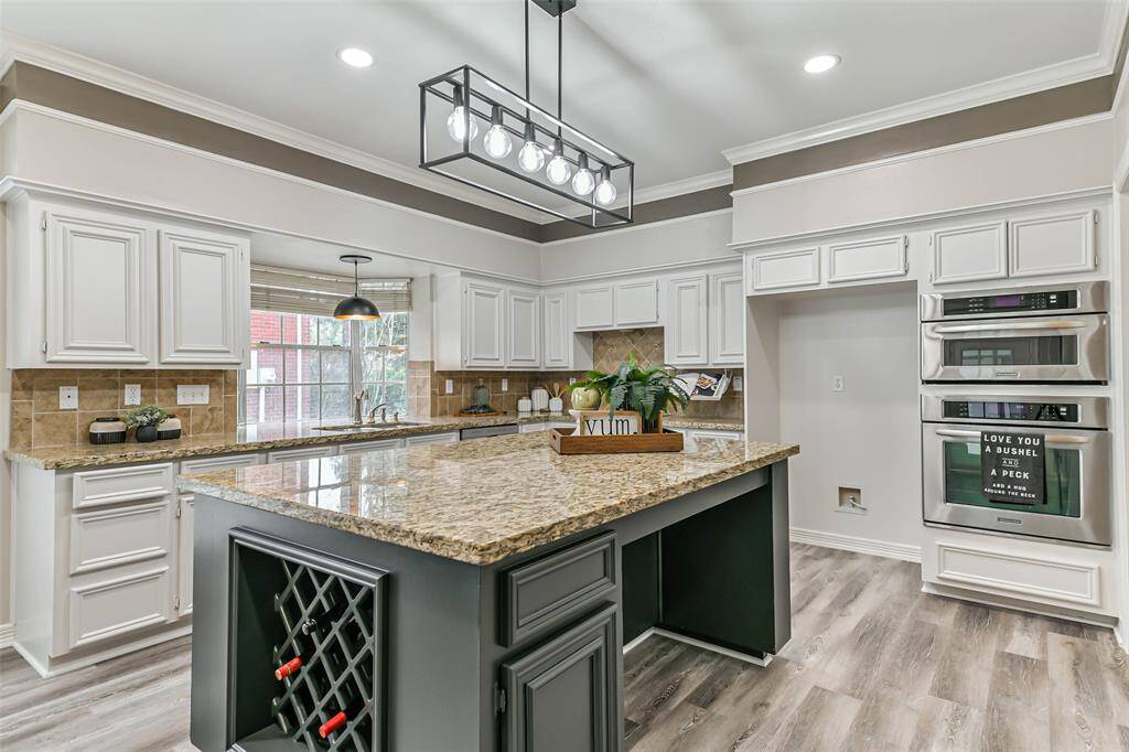 spacious island with breakfast bar and wine rack