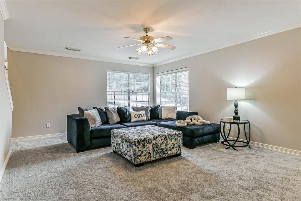 living room located upstairs with split floor plan of bedrooms