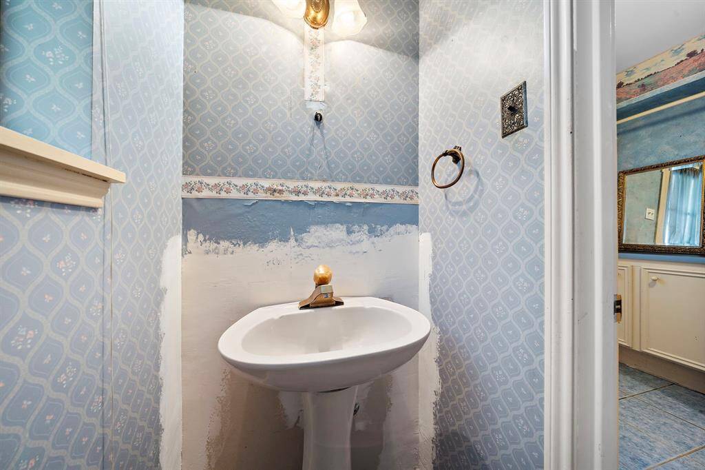 Half bath with a pedestal sink.