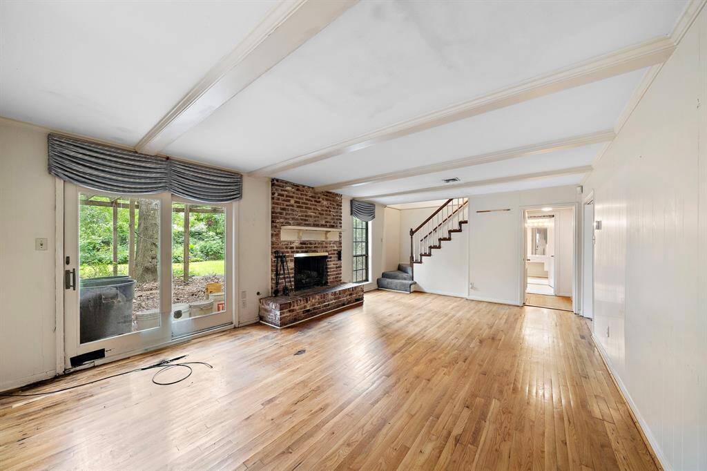 Lovely exposed beams and doors leading out to the backyard.