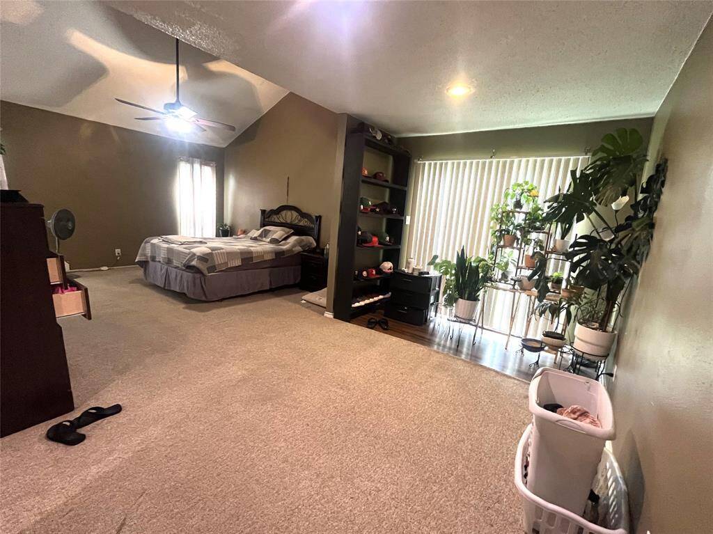 Carpeted Primary Bedroom with sitting area